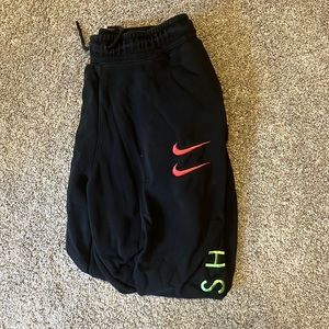 Nike tapered sweatpants, designs on legs
